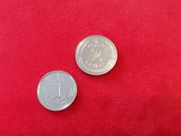 НБУ планирует изменить дизайн монет номиналом 1 и 2 грн, адаптируя для людей с нарушениями зрения